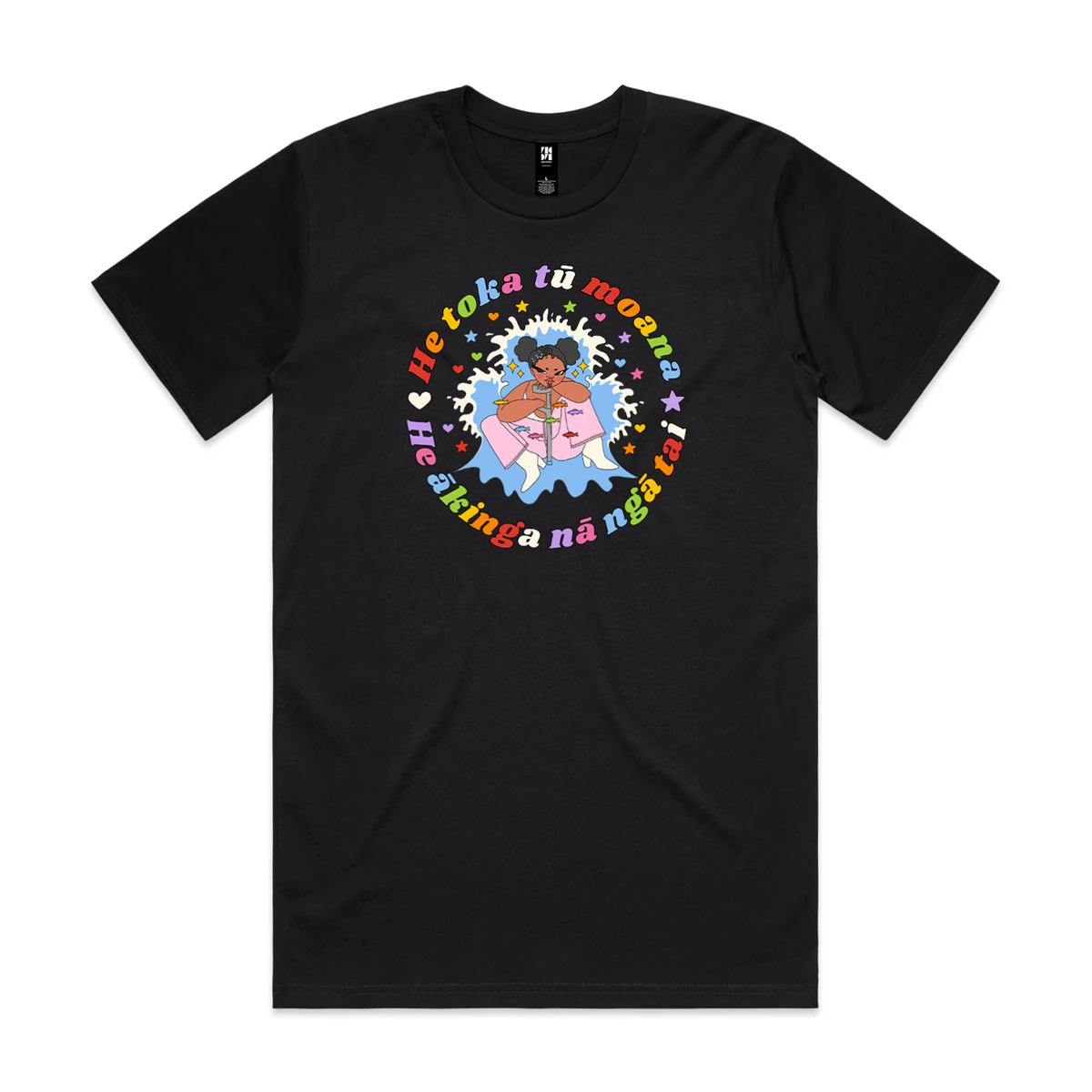 A black T-shirt with a person with a moko kauae and a crutch amid a splash and stars, surrounded by colourful text reading “He toka tū moana, he ākinga nā ngā tai.”
